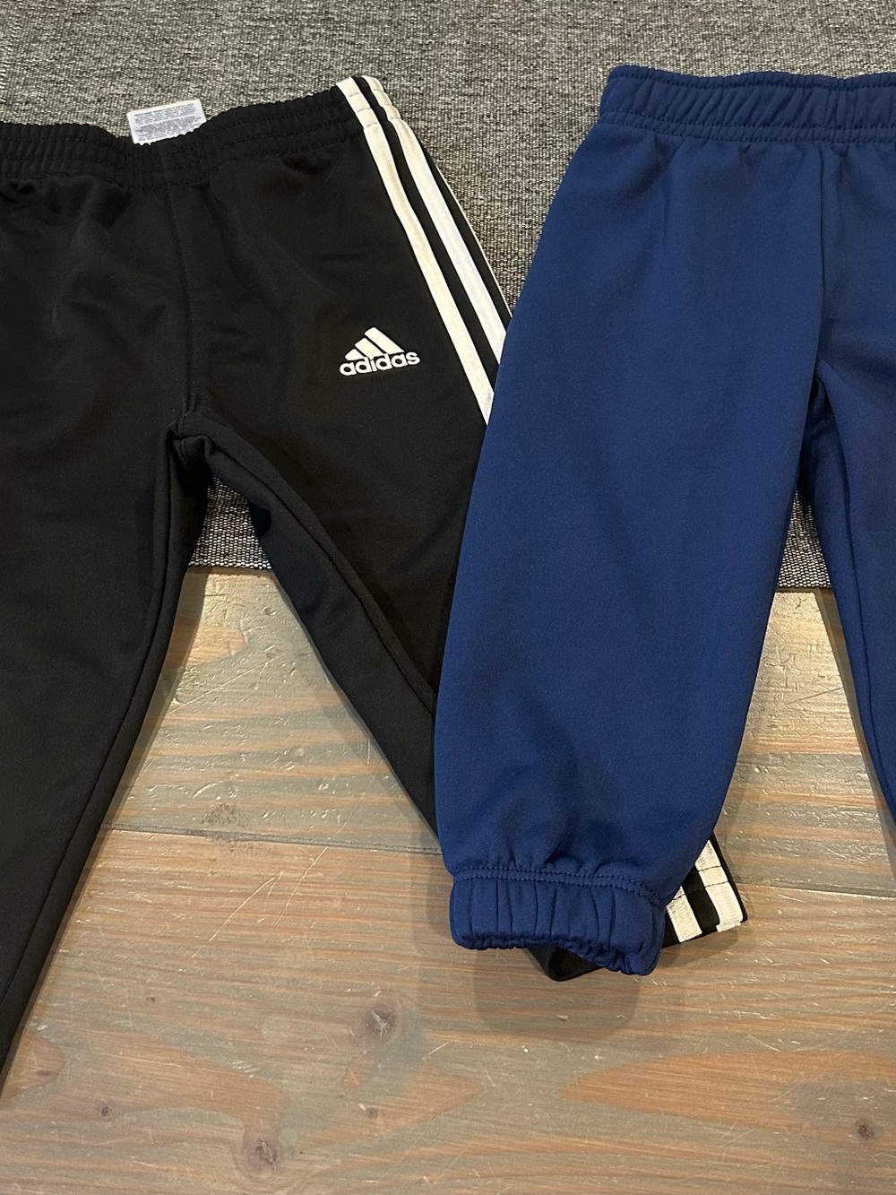 Size 12 month - 1 pr adidas Kids Black/White and 1 pr Nike blue joggers
